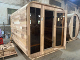 The Cube outdoor sauna, cedar barrel-roof exterior, door open